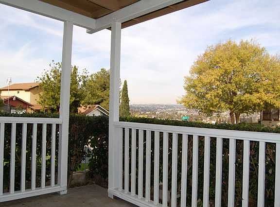 ADD SOME CHAIRS AND A TABLE TO THIS WONDERFUL FRONT PORCH AND ENJOY THE VIEW!