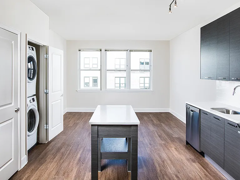 Fully Functional Kitchen with Island and Stackable Front Loading Washer/Dryer