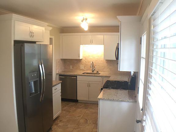 All new kitchen! Granite, tile backsplash, cabinets, applian