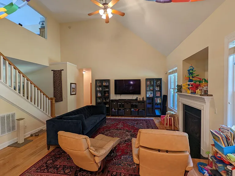 The great room with vaulted ceiling and gas fireplace.