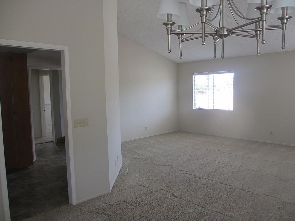 Living area from dining with kitchen to left