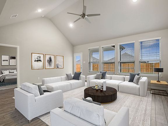 Living room in the Stanley home plan by Trophy Signature Homes - REPRESENTATIVE PHOTO