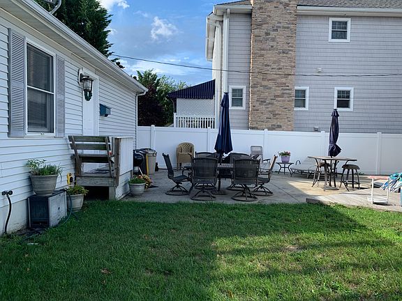 Side View of front of house w/ shared patio.