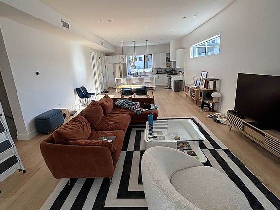Open floorplan kitchen + living room, in total about 1500 ft. Some of this furniture included.