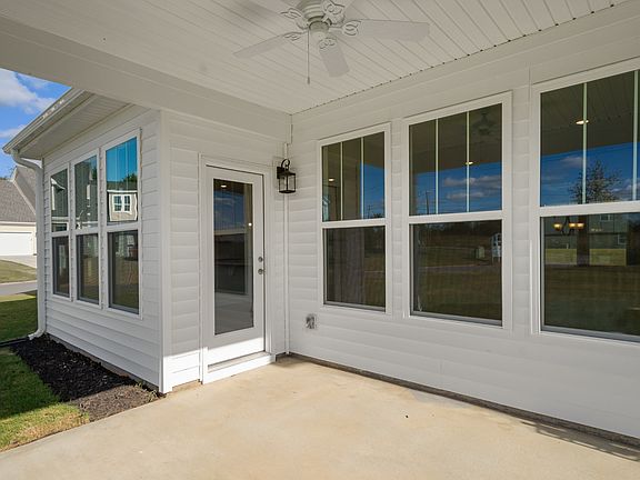2 story single family home, all white with a 2 car garage