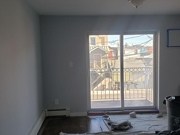 Large Living Room with Double Sliding Doors Leading Out to A Private Balcony