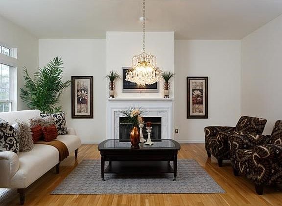 There are so many different options for rooms in this villa. We have set this up as a Hearth room. Gas fireplace, hardwood floors, so inviting and open to the kitchen/breakfast room.