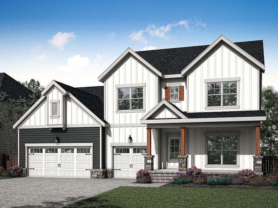 Experience elegant design with white vertical siding, wooden shutters and stone pillars in Brush Cre