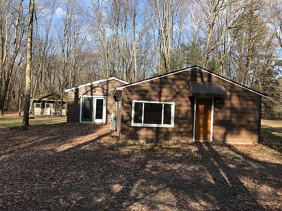 Exterior view with pavilion in background. Entrance in center. (Fall)