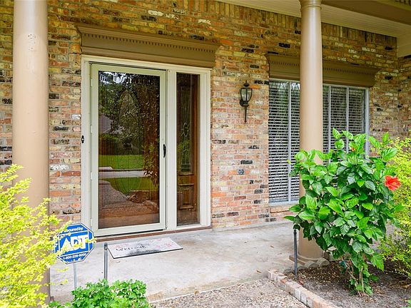 A Covered front porch greets you as you enter the home. Outside flood lights are programmable to come on and go off.