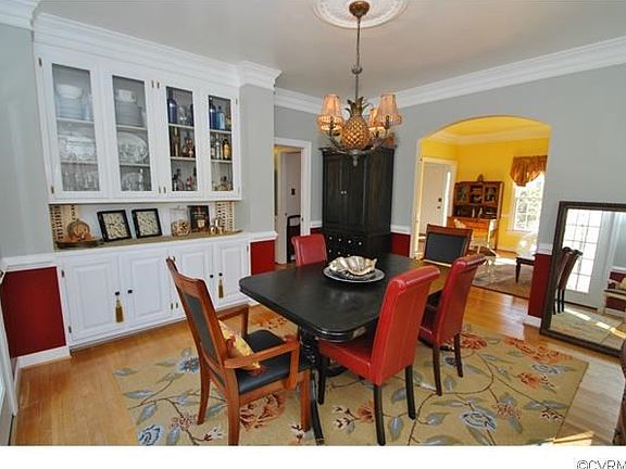 Your dining room features hardwood flooring, glass doors leading