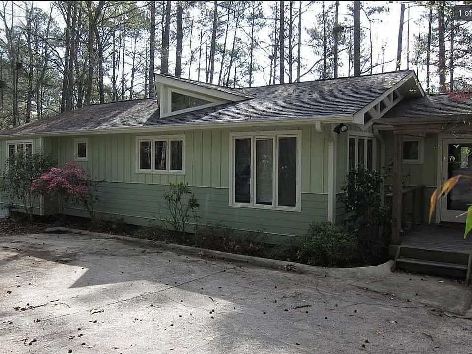 Surrounded by tall pines with private parking