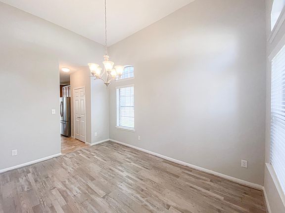 The dining room with chandelier and is adjacent to the kitchen- set the table, light the candles and get ready for the holidays!
