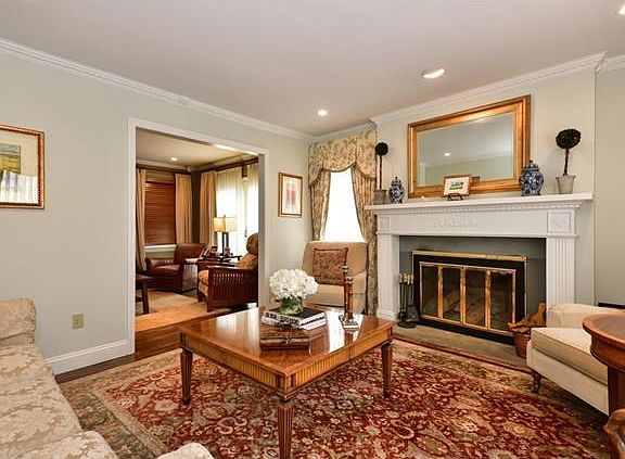 Warmth and elegance with a wood burning fireplace in the living room