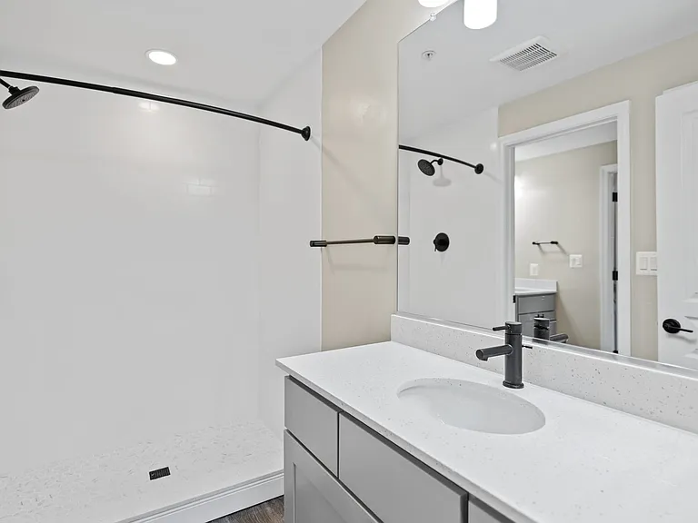 Select homes feature upgraded bathrooms with quartz countertops and wood flooring