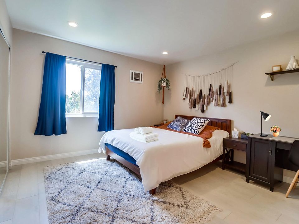 Recharge in this cloud-like queen bed in Bedroom 2 w/ a nearby workspace