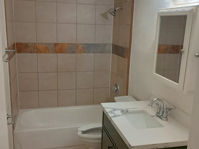 remodeled bathroom with tile surround
