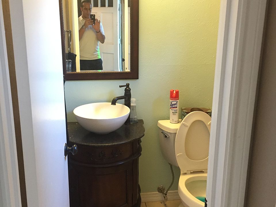 Downstairs half bath. Closets on both side of the entrance