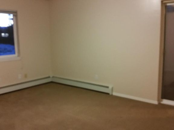 Master bedroom that opens up to a deck overlooking the back 