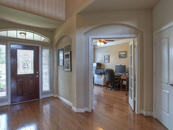 Dramatic entrance, hardwood flooring, opens to home office/study