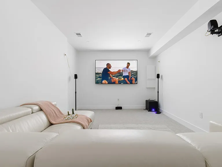 Movie theater with leather recliners and 86" SmartTV!