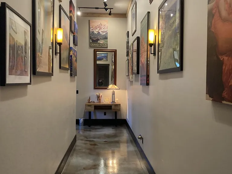 A third desk is featured in the hallway, and Art gallery!