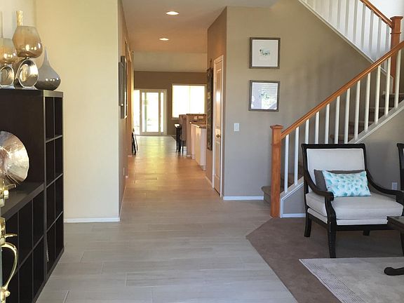 From the front door, the living room is on the right, kitche