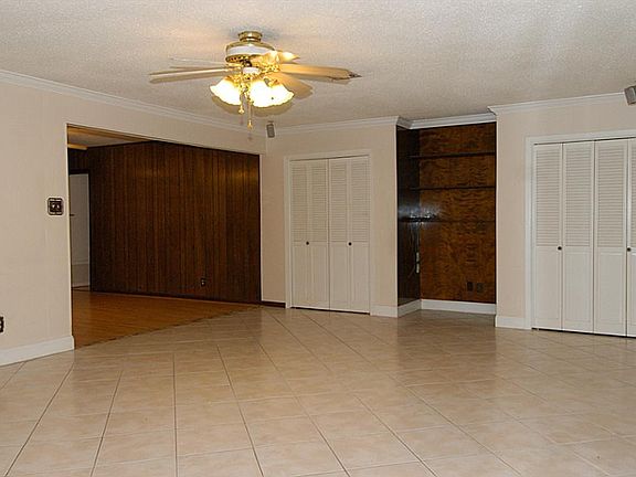 ENTERTAINMENT  NOOK FLANKED BY STORAGE AREAS.