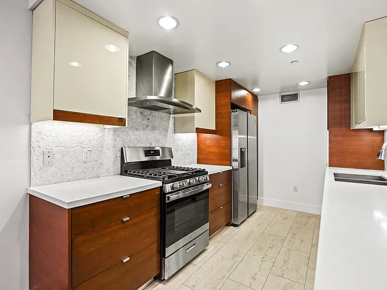 Kitchen with Stainless Steel Appliances and Ample Cabinet Storage