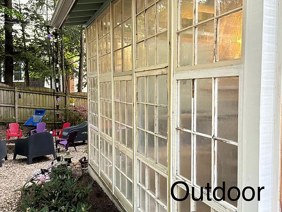 Back yard, glass room and fire pit