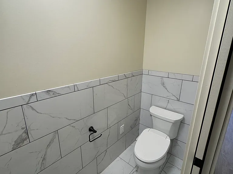 half bath, electric bidet seat, and tiles