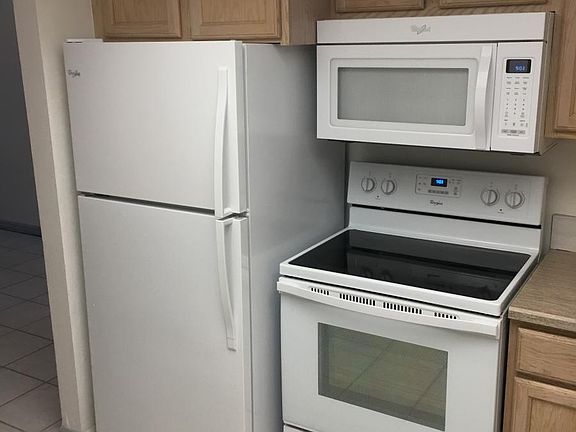 Kitchen, refrigerator and stove. Less than 1 year old.