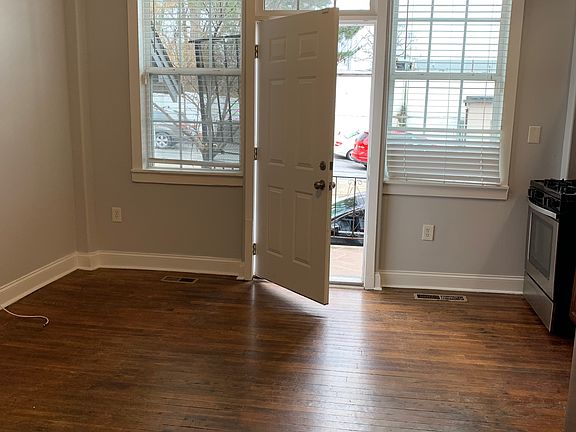 Living room with door to front private balcony