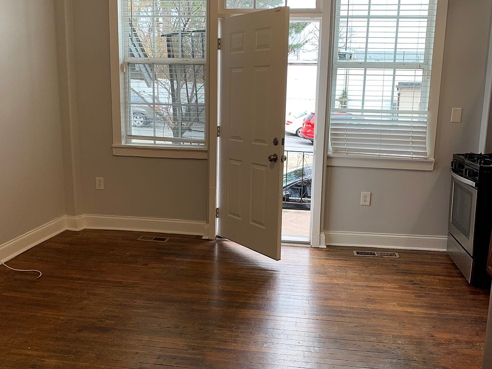 Living room with door to front private balcony