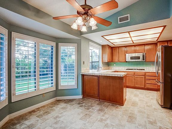 Kitchen, all white cabinets, walls, & updated lighting (updates not shown).