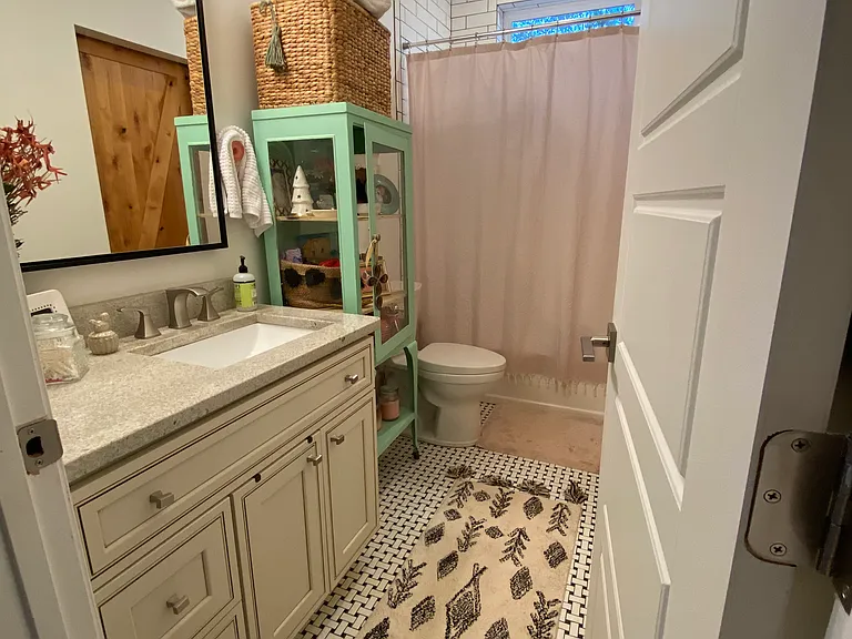 Bathroom 1 with shower/tub combo.