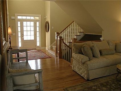 Two Story Entry foyer with hardwood flooring