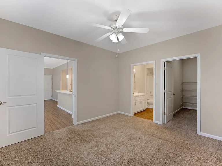 The primary bedrooms feature spacious walk-in closets and private bathrooms, offering comfort and convenience at Ascent at the Galleria.