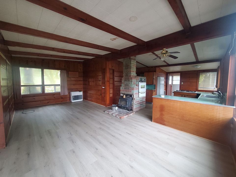 Open layout for living room, kitchen, and dining area.