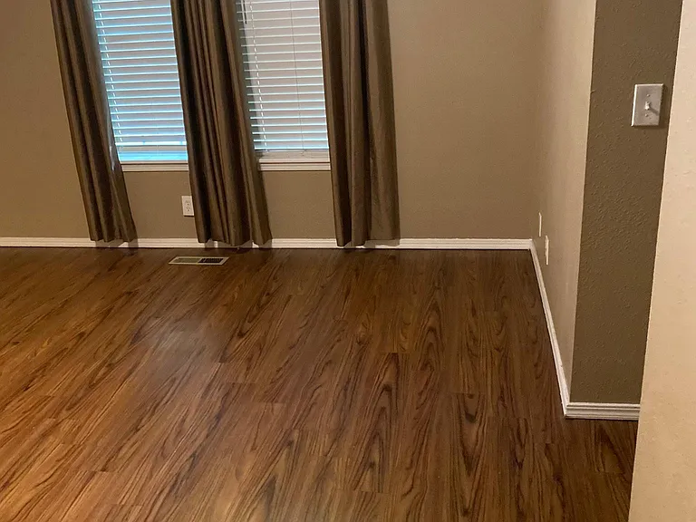 Primary bedroom has vaulted ceilings and new vinyl plank floors as do other downstairs bedrooms and hallways.