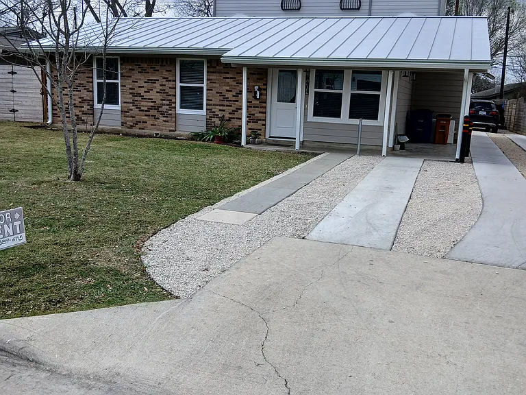 House is 1 story, ranch style. 3 story duplex in rear is rented. Shared driveway.