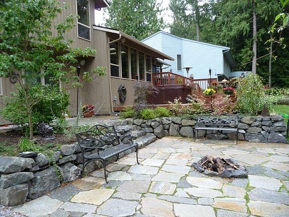 Firepit and stone wall off lower family room.