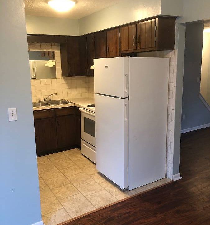 Kitchen with stove and refrigerator