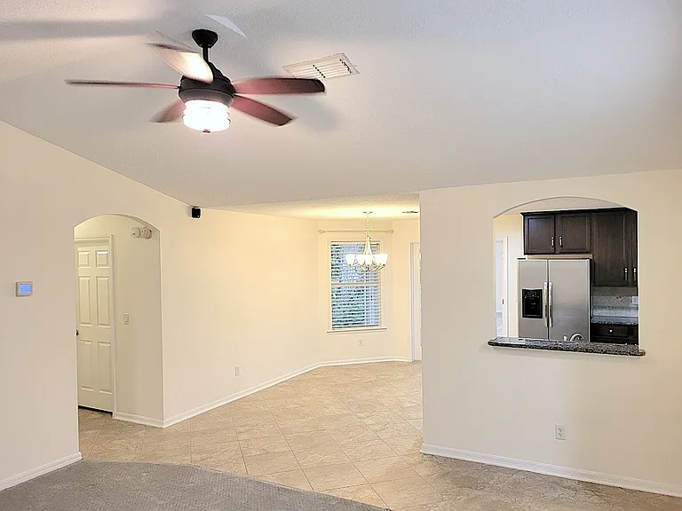 Hallway to secondary bedrooms, picture left, and breakfast area view from living room.