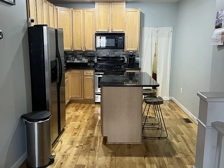 Kitchen area with applicances and storage