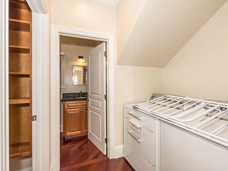 Laundry area with pantry room and looking towards downstairs bathroom