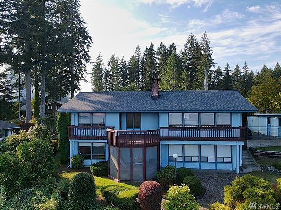 This daylight-basement house sure has plenty of opportunities to look out the windows at that beautiful view!