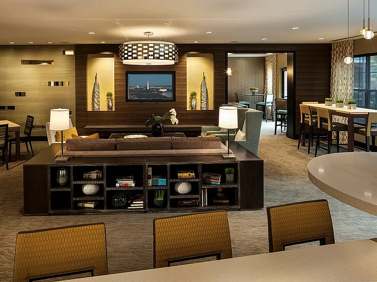 Contemporary Club Room With Bar Area, TV & Numerous Seating Areas