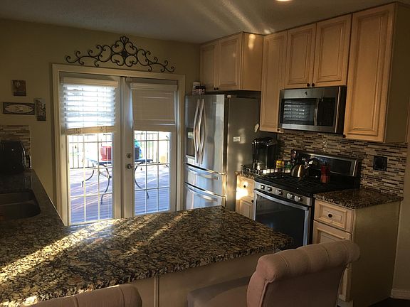 Kitchen with French doors that open to deck