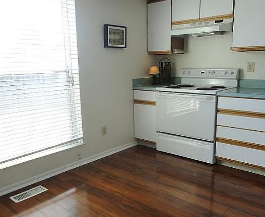 Kitchen with eating area and new cherry amber floors.